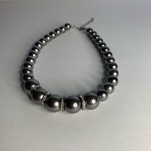 Gray Pearl necklace with diamond embellishment.